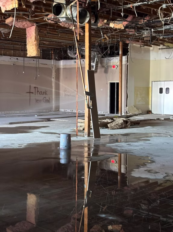Water damage in a property near you — standing water awaiting restoration